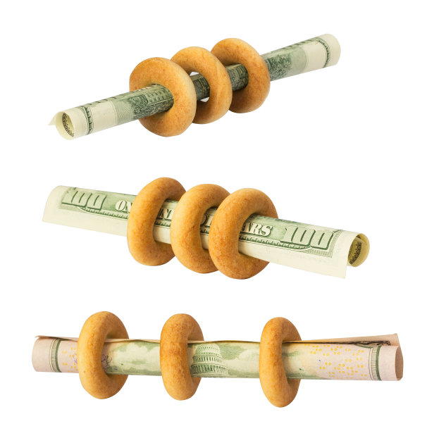 白面包上印着美元。收益、破产、储蓄或其他商业标志图片下载