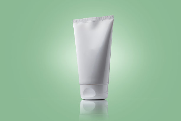 奶油管浅绿色背景。具有复制空间的护肤理念。图片下载