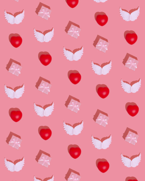 礼盒、白色天使的翅膀和红色的心都是在极小的平面上制作图案的爱的创意概念。情人节浪漫的创意在粉红色的背景上。图片下载