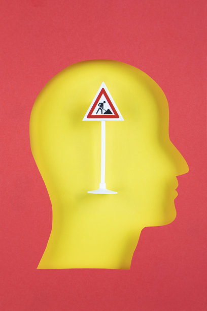 人的头部剪纸风格与道路工作交通标志图片下载