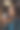 一个穿着蓝色连帽衫的漂亮女孩坐在咖啡桌旁。女人用一个大杯子喝咖啡。舒适的气氛。图片下载