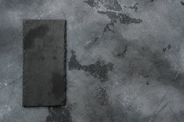 石刻板空有文字或食物的拷贝空间，文字或食物的拷贝空间，俯视图平躺，在灰色的石头桌子背景上图片下载