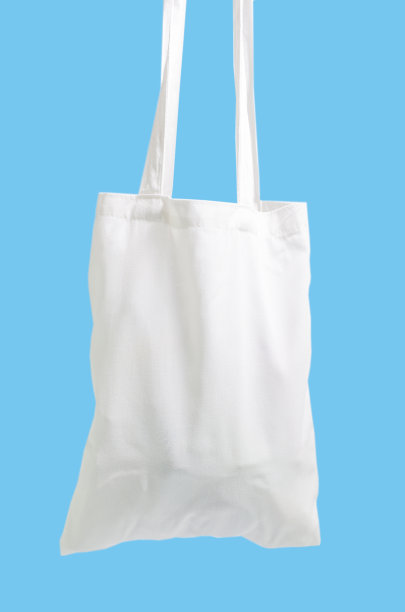 蓝色背景上的袋子减少全球变暖图片下载