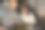 一头卷发的男孩面带微笑，戴着无线耳机，在笔记本电脑前完成学校的作业直到深夜。他听音乐，做作业图片下载