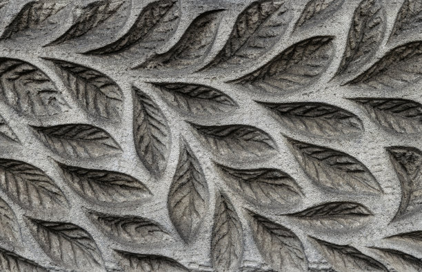 雕刻花卉图案的石墙图片下载