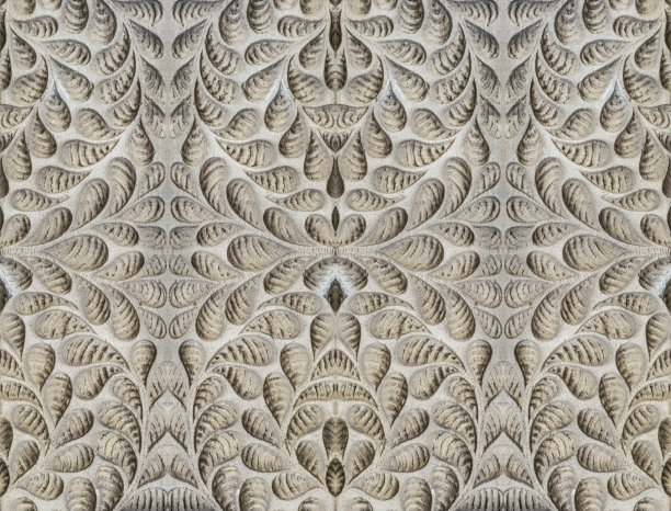 雕刻花卉图案的石墙图片下载