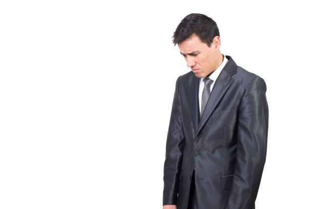 穿着优雅西装向下看的不开心的人图片下载