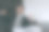 年轻的成功雇员，喜出眉外的商人公司律师穿着正式的黑色西装衬衫领带读纸文件做胜利者的姿势握拳坐在厨房的桌子旁。人们生活方式的概念图片下载