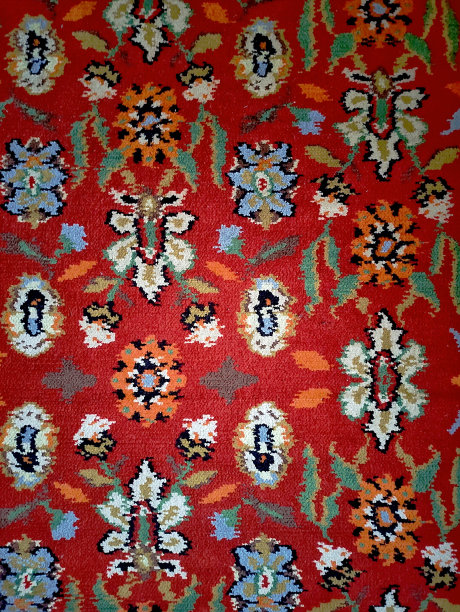 波斯地毯的纹理，抽象的点缀。圆形曼陀罗图案，传统的中东地毯织物纹理。红色，乳绿色，米色，浅绿色，棕色。复古,东方主题图片下载