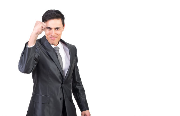 成功的年轻优雅的家伙，展示拳头姿势和微笑图片下载