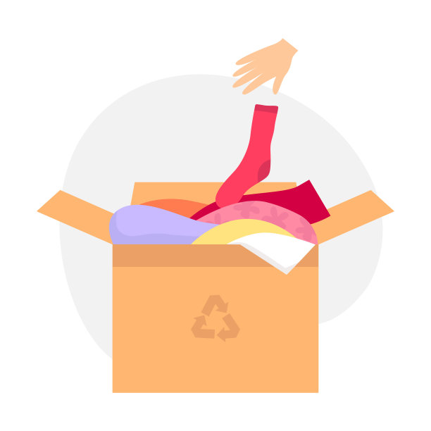 装着旧衣服的纸箱，用于回收利用。那只手把袜子扔进盒子里图片下载