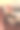 照片中，一名穿着米色运动服和时尚皮鞋的女性坐在椅子上。有选择性的重点图片下载
