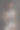 穿着米色西装，戴着眼镜的自信男子坐在那里图片下载
