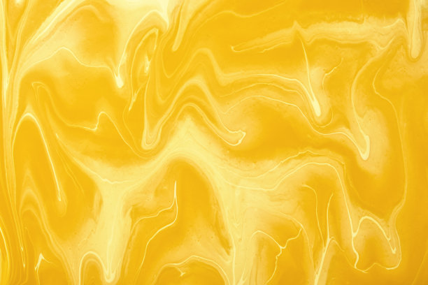 抽象流动的艺术背景黄色和金色的色彩。液体的大理石。丙烯酸画赭色梯度图片下载
