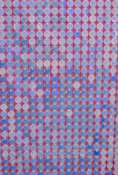 粉红色和紫色亮片的背景。模式图片下载