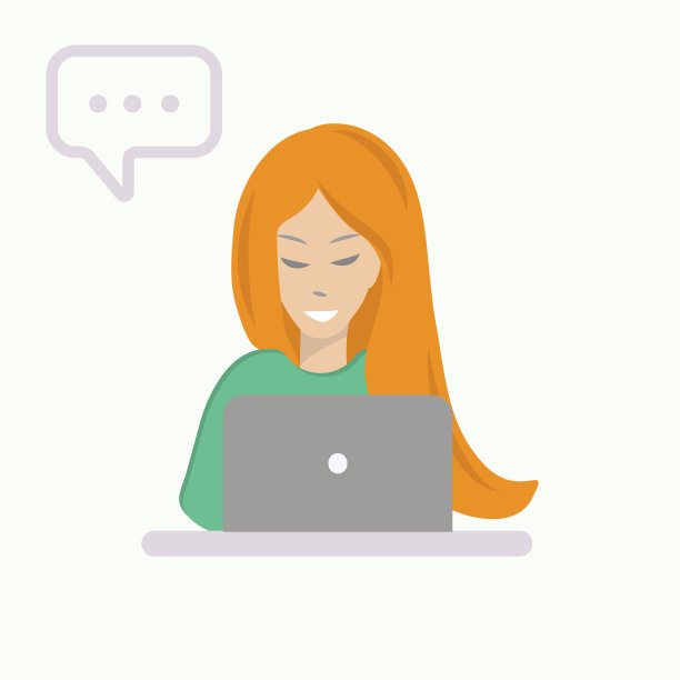 红发微笑的女孩坐在笔记本电脑前图片下载