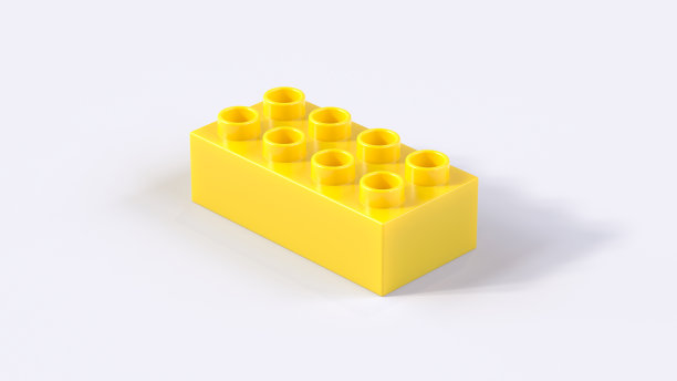 白色背景上的黄色塑料玩具砖的透视视图。图片下载