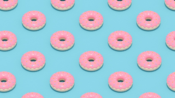 阳光下蓝色背景的甜甜圈图片下载