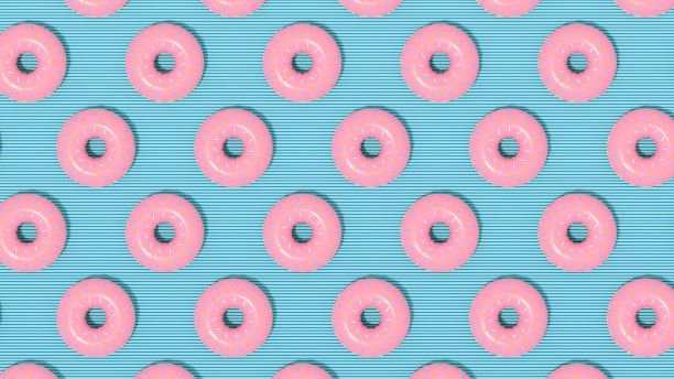 阳光下蓝色背景的甜甜圈图片下载