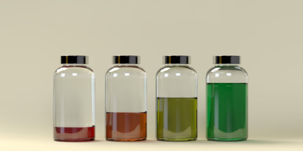 四个透明的瓶子排列在灰色的上面，上面有各种各样的液体。图片下载