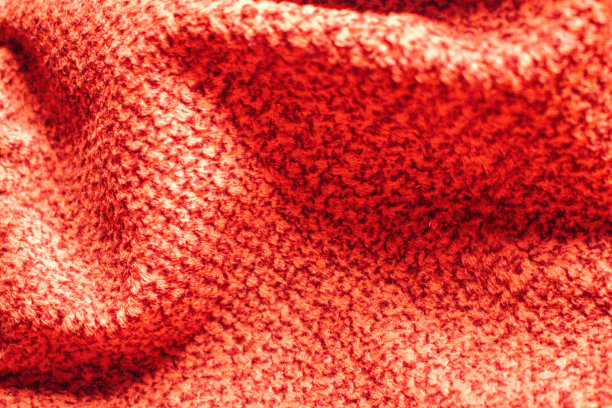 红色华贵厚毛衣面料近距离编织背景冬季温暖围巾服装纺织品舒适缝纫工作室制造布绒覆盖图片下载