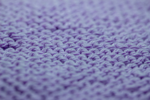 宏观抽象背景的手编纱织物纹理，颜色为紫色图片下载