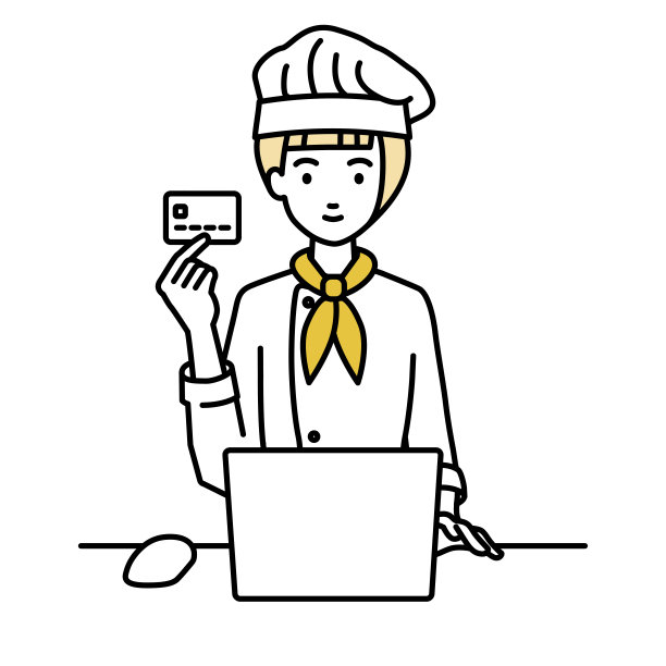 一个女厨师在她的桌子上用笔记本电脑，手里拿着一张信用卡图片下载