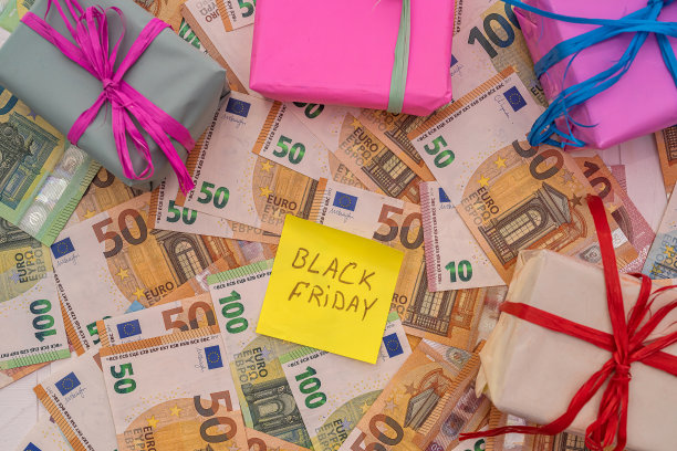 文本黑色星期五与欧元货币的礼品盒贴纸作为背景图片下载