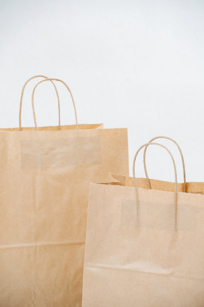 近距离裁剪图像的两个棕色纸袋与绳子处理图片下载