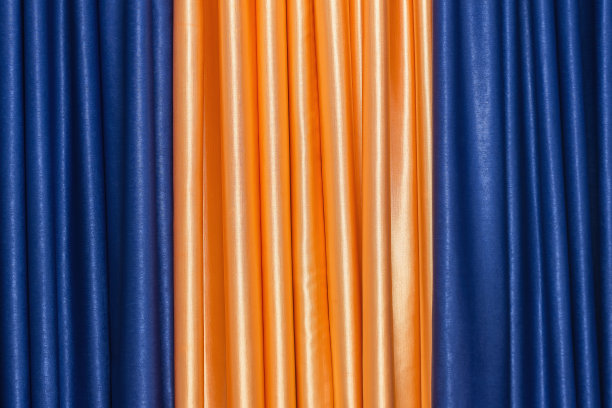 金黄色和蓝色的褶皱织物。的背景图片。图片下载