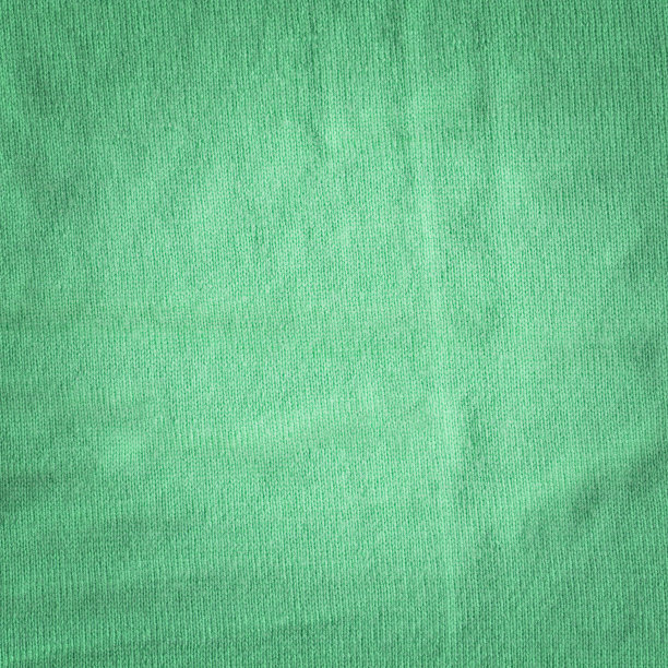 温暖的绿色卡其针织羊毛背景。美丽的针织羊毛纺织品作为背景图片下载