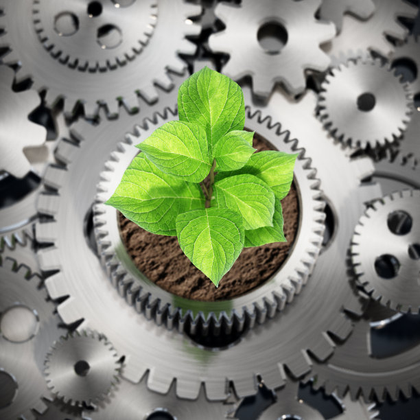 植物生长在花盆形齿轮内运动。可持续的工业增长理念。图片下载