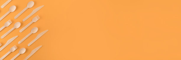 旗帜与天然木制餐具套由天然竹子制成-可生物降解和可堆肥的餐具概念。橙色背景的竹制餐具。环保理念，复制空间图片下载