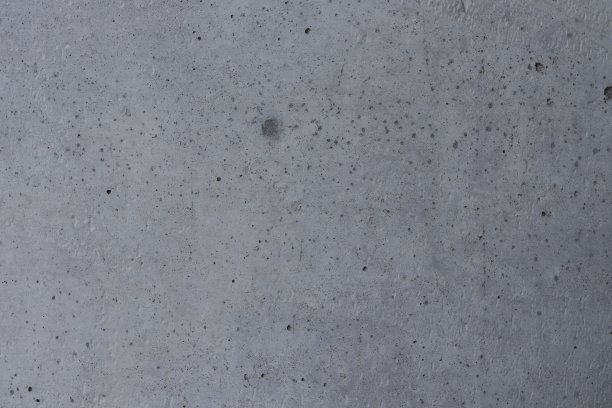 表面有灰色混凝土和黑点。图片下载