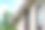 单山墙特写与白色拱腹，筋膜，米色乙烯基壁板公寓建筑与几个屋顶窗与中性天空背景图片下载