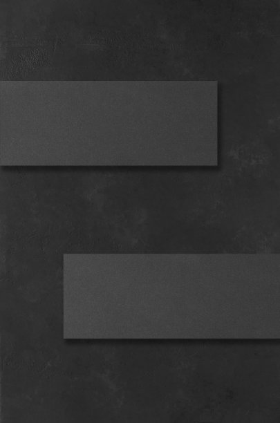 黑色矩形模型在黑暗的混凝土背景。设计元素或作品集。本空间图片下载