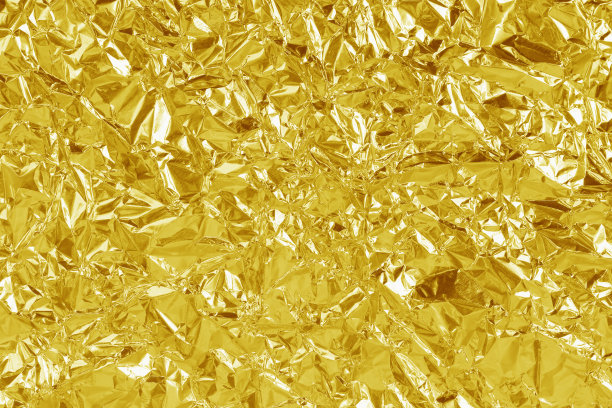 金箔叶片光泽质感，抽象黄色包装纸为背景和设计艺术作品。图片下载