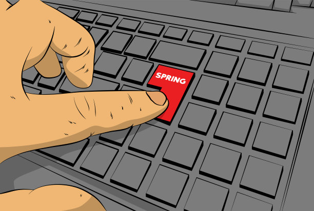 电脑键盘上的弹簧字。男子按键盘上的笔记本电脑。图片下载