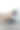 穿黑靴子的女孩把脚翘在沙发上。图片下载