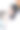 冬天的山里，一个年轻的女人在阳台上喝着咖啡。图片下载