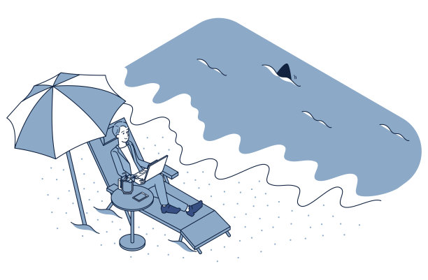 一个男人坐在沙滩上的椅子上工作图片下载