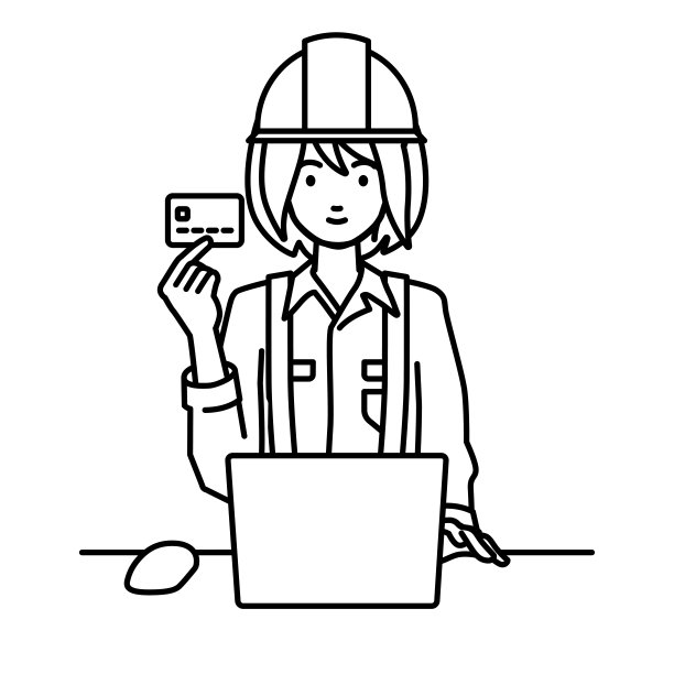 一位在建筑工地工作的妇女，在她的办公桌上使用笔记本电脑，手里拿着一张信用卡图片下载