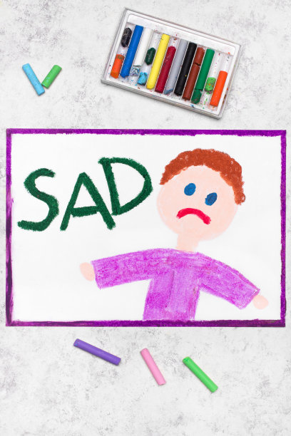 彩色图画:悲伤的男孩和单词Sad图片下载