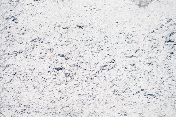 摘要真实照片grunge背景。浅灰色混凝土水泥白色浅灰色灰浆腻子墙宏观近距离纹理表面拍摄。设计、装饰修剪。模糊的观点图片下载