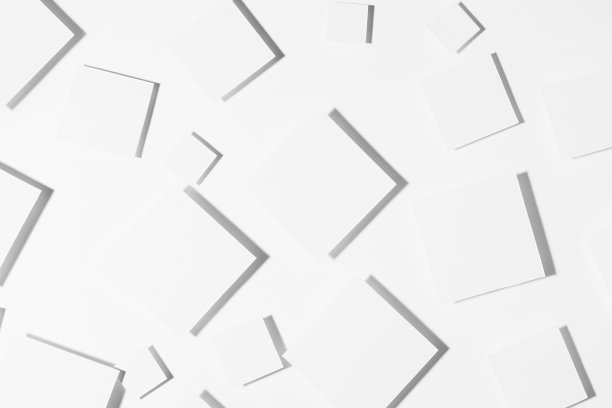 白色几何随机模式的菱形在硬光与严格的灰色阴影，顶视图。未来风格的现代抽象背景。图片下载