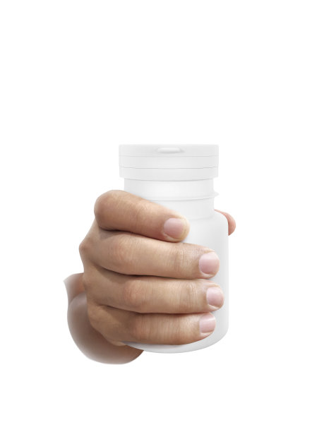 一瓶药在手孤立的白色背景图片下载