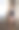 孤独的胖女人站在家里的窗户外看着。图片下载