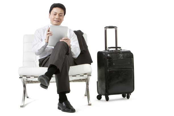 出差的商务男士和平板电脑图片下载