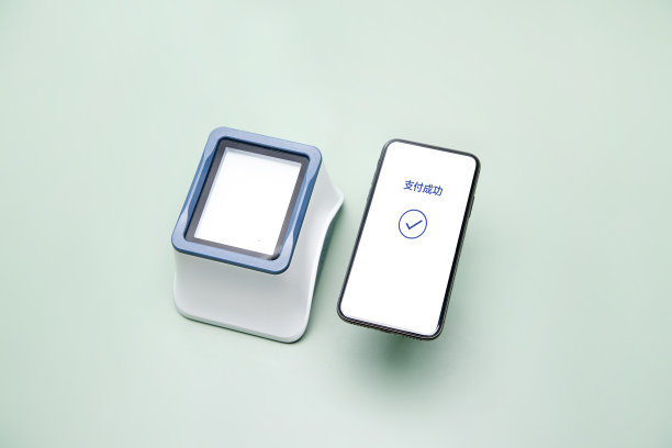 手机扫码支付盒子和显示成功支付的手机图片下载