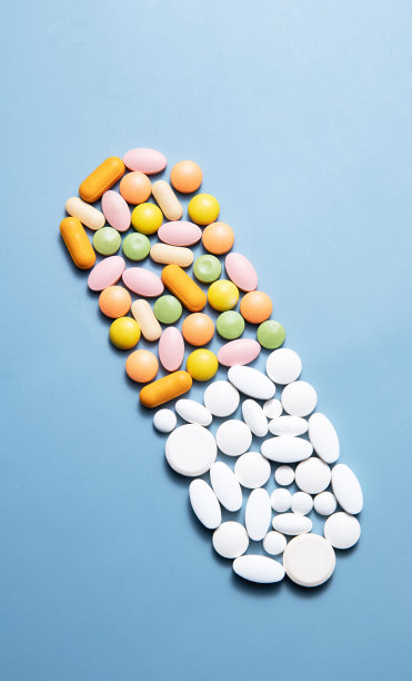 多色药丸摆成胶囊形状图片下载